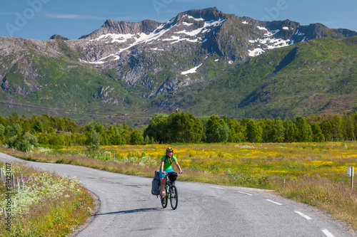 Biking in Norway against picturesque landscape © Maygutyak