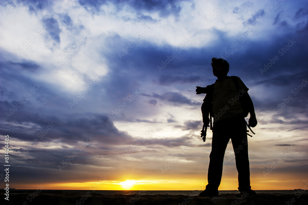 Portrait of young man as silhouette by the sea at dawn. Portrait of young man as silhouette by the sea at dawn.