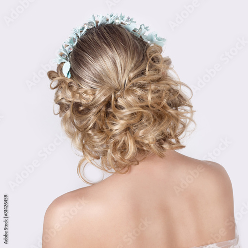 elegant beautiful girl in image of bride with flowers in hair