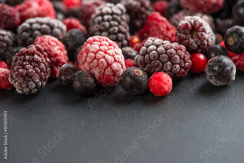 frozen berries, border food background
