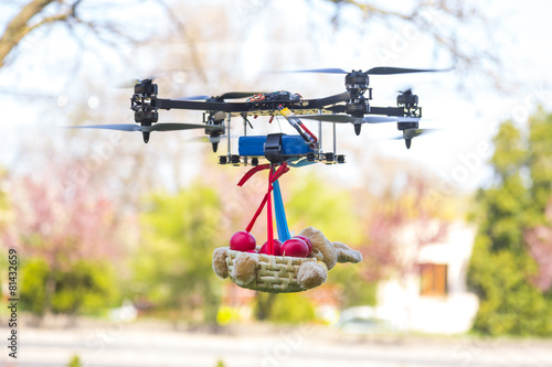 Drone carrying a basket with Easter red eggs