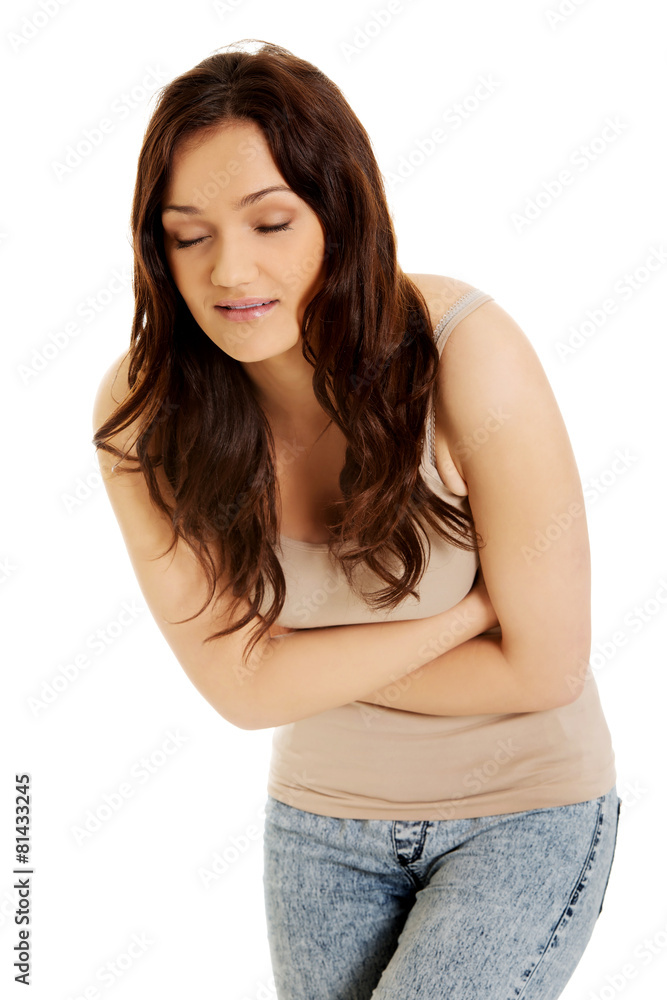 Woman suffering from severe pain in her tummy. Woman suffering from severe pain in her tummy.