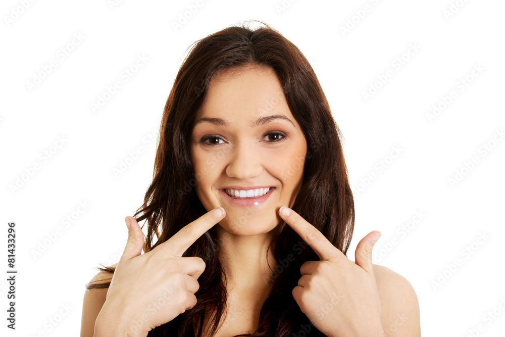 Young woman showing her perfect teeth. Young woman showing her perfect teeth.