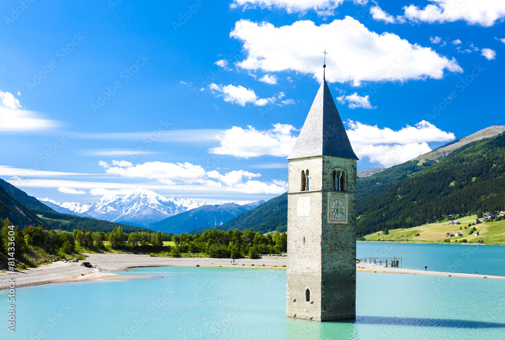 tower of sunken church in Resia lake, South Tyrol, Italy