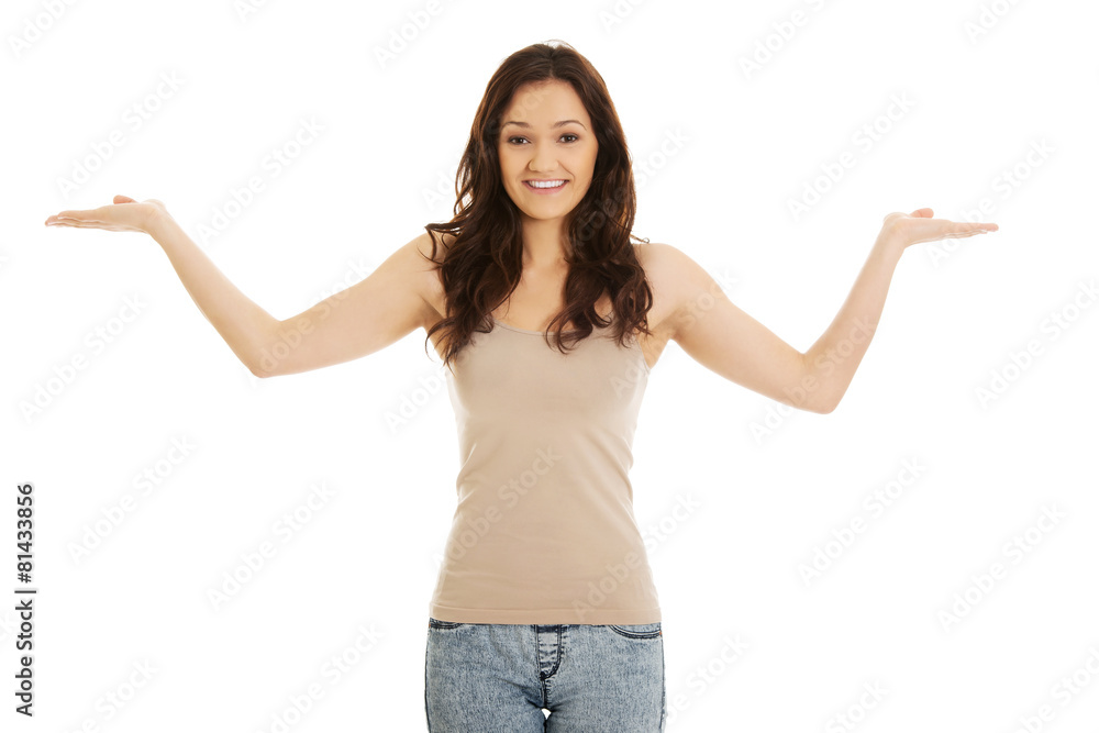 Young woman holding copy space in hands. Young woman holding copy space in hands.