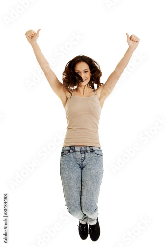 Young casual woman jumping.