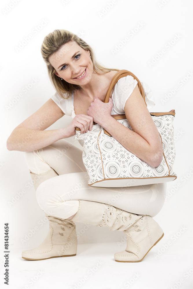 woman wearing summer boots with a handbag woman wearing summer boots with a handbag
