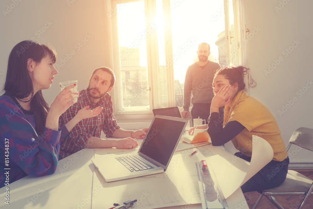 Young group of people discussing business plans. Young group of people discussing business plans.
