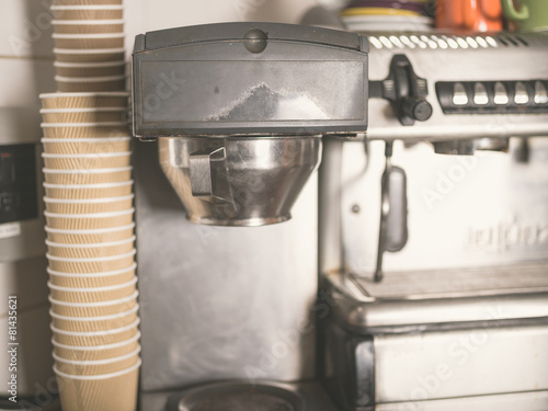 Coffee machine and paper cups photo