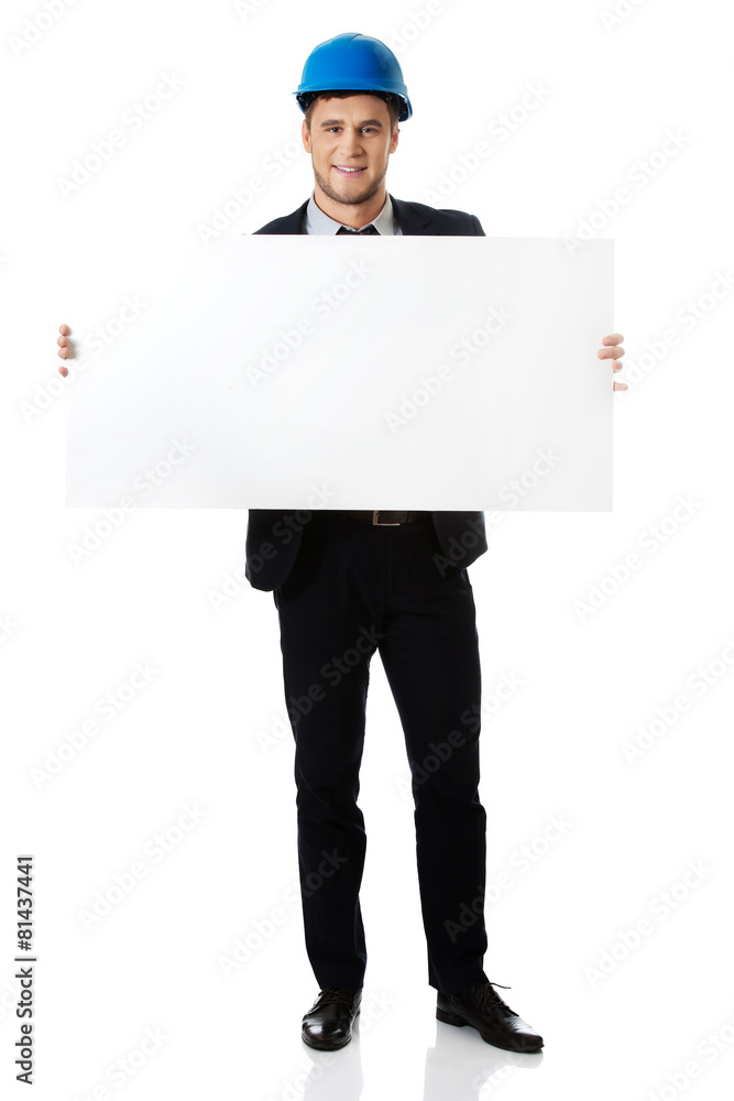 Businessman enginner holding empty banner. Businessman enginner holding empty banner.