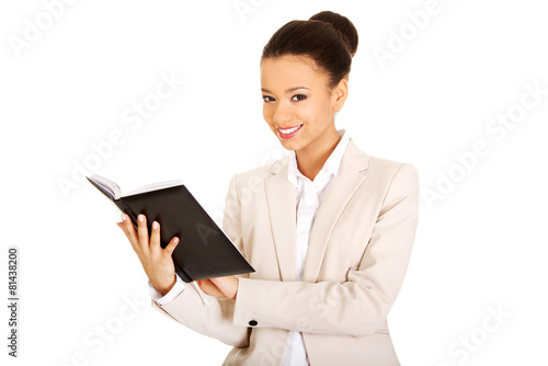 Businesswoman with a notebook.