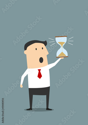 Businessman with sandglass worrying about deadline