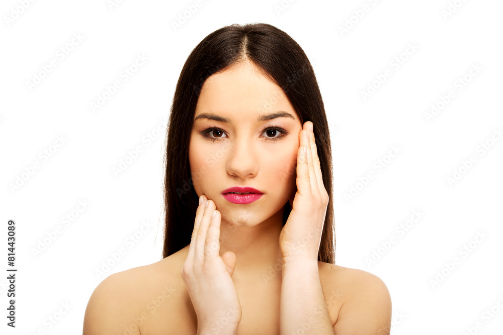 Woman with full make up touching face. Woman with full make up touching face.