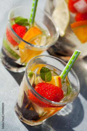 Refreshing white sangria (punch) with fruits, picnic idea
