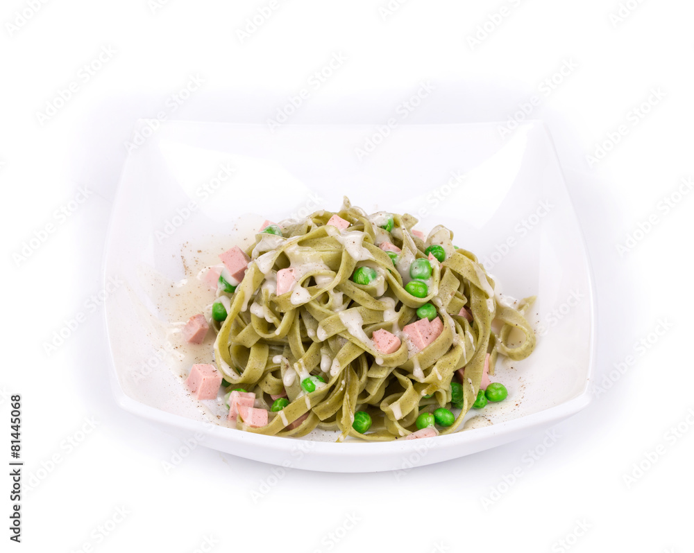 Pasta tagliatelle with green peas and ham.