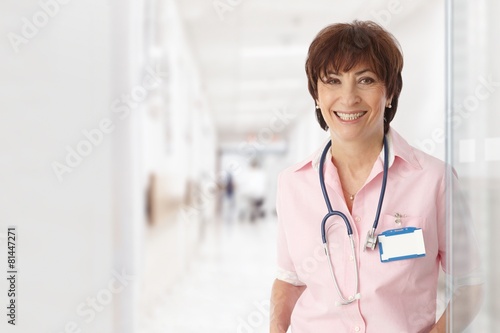 Senior female doctor in hospital smiling