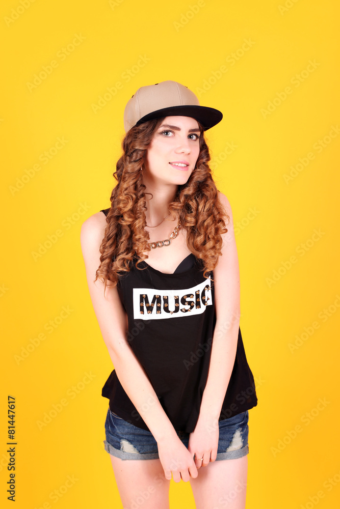 Naklejka premium Portrait of a happy young sexy swag woman in stylish clothes 