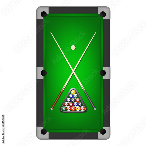 Billiards balls, triangle and two cues on a pool table.