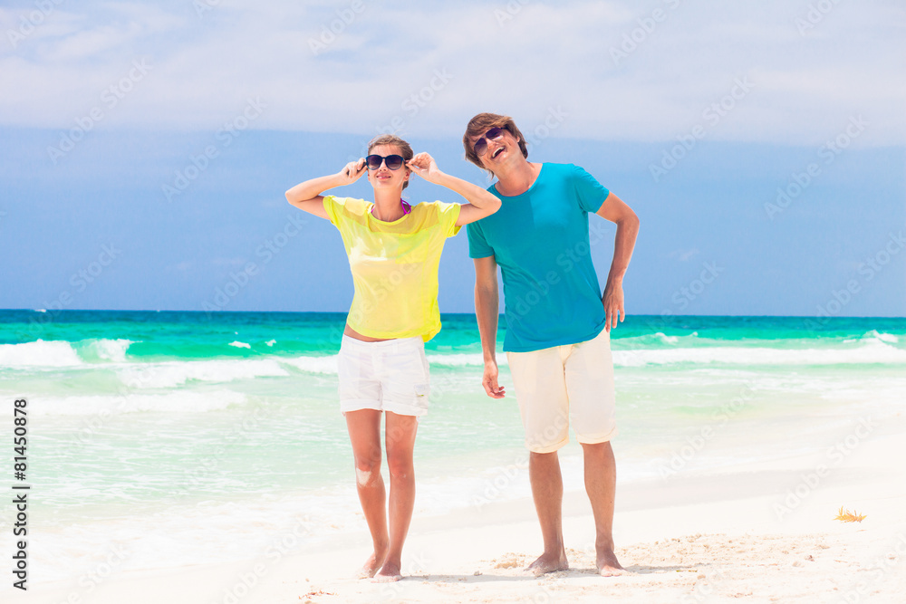 front view of happy couple on the beach front view of happy couple on the beach