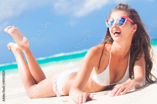 long haired girl in bikini having fun on tropical barbados beach