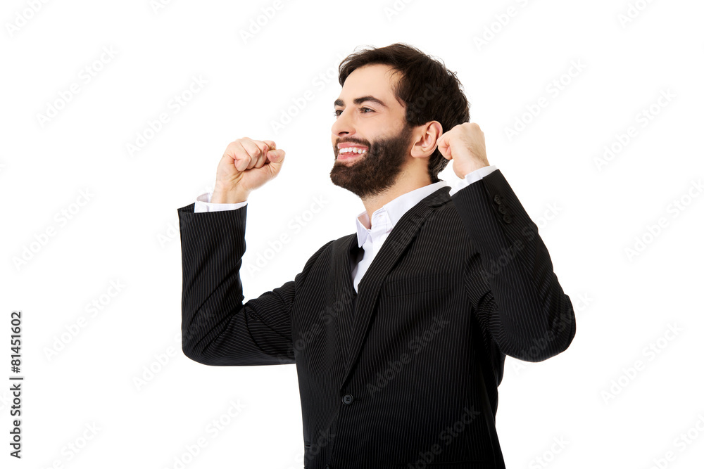 Businessman making fists in a winner gesture. Businessman making fists in a winner gesture.