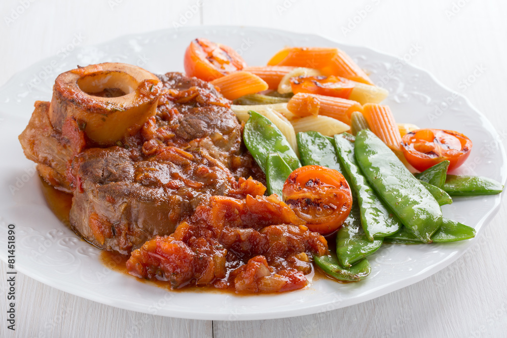 Ossobuco. Сross-cut veal shanks braised with vegetables. Ossobuco. Сross-cut veal shanks braised with vegetables.
