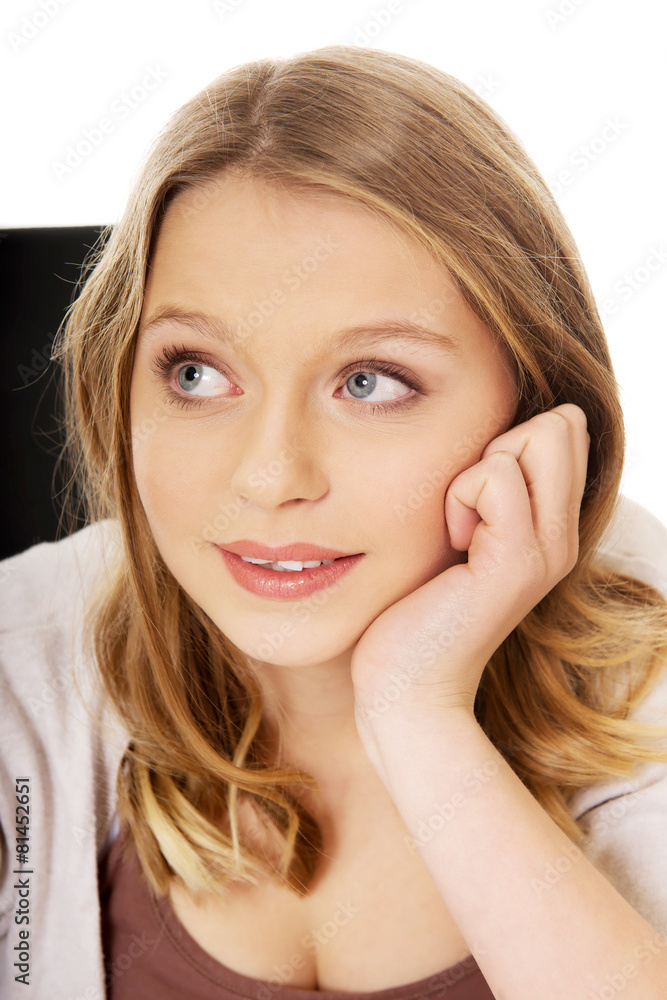 Young happy woman sitting on armchair Young happy woman sitting on armchair