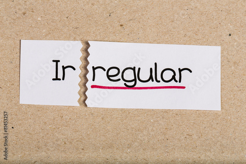 Cuadro en lienzo Sign with word irregular turned into regular