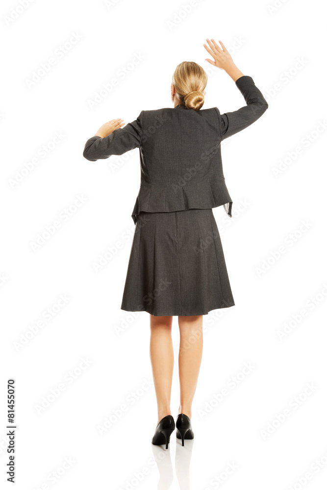 Woman pressing an abstract screen Woman pressing an abstract screen
