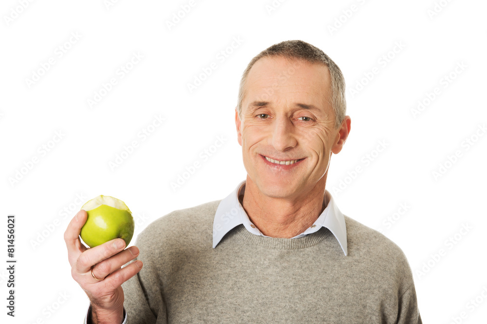 Mature man with an apple Mature man with an apple