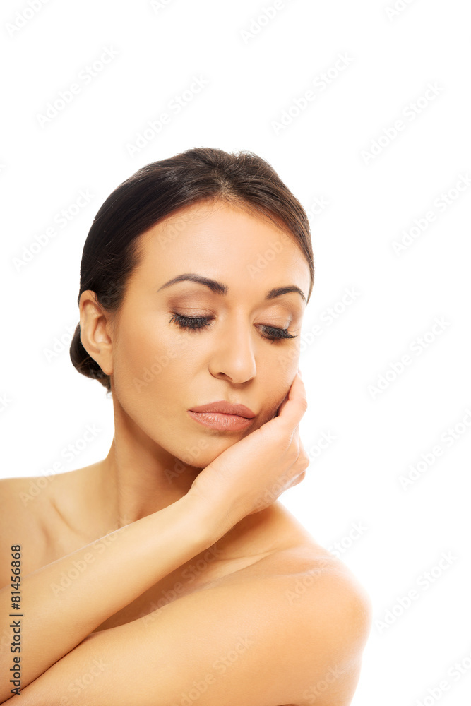 Beautiful spa woman holding hand on chin Beautiful spa woman holding hand on chin