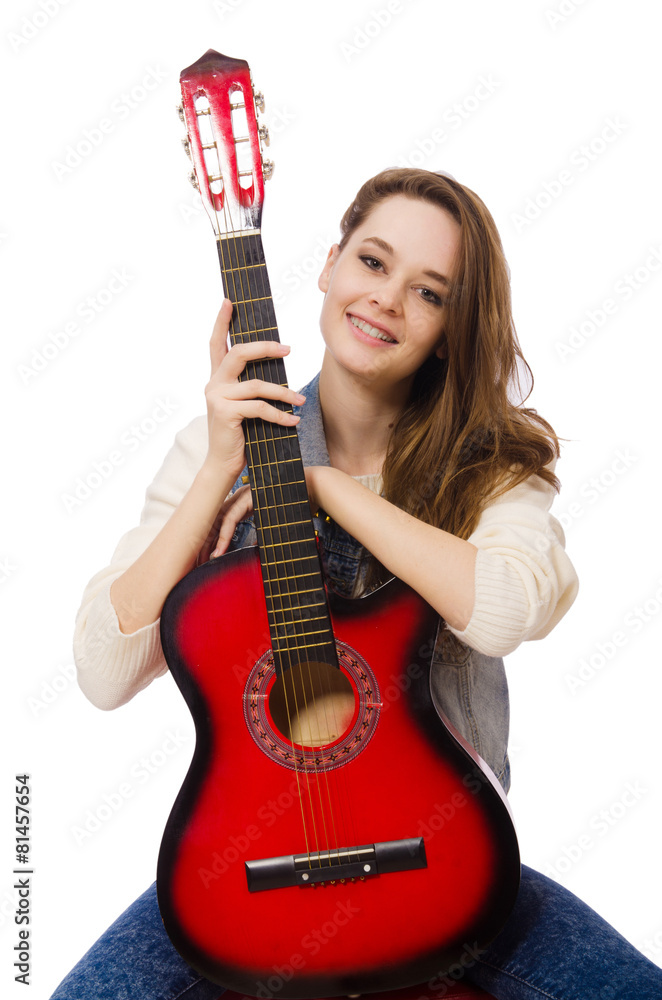 Fototapeta premium Young smiling girl with guitar isolated on white