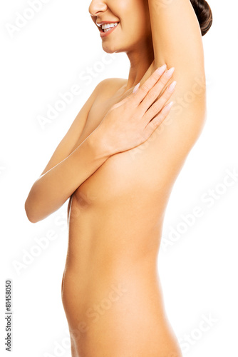 Beautiful spa woman touching an armpit