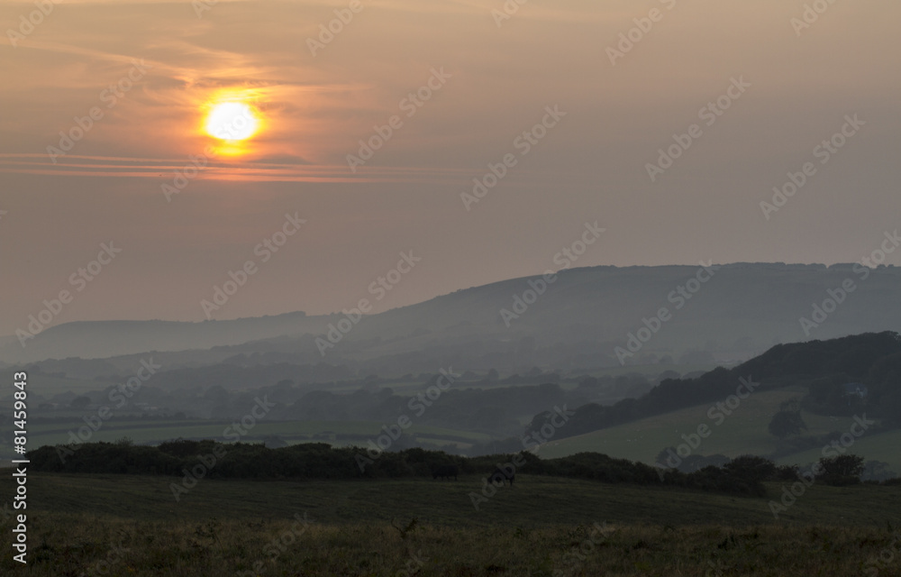 moody and calming sunset over Corfe Common