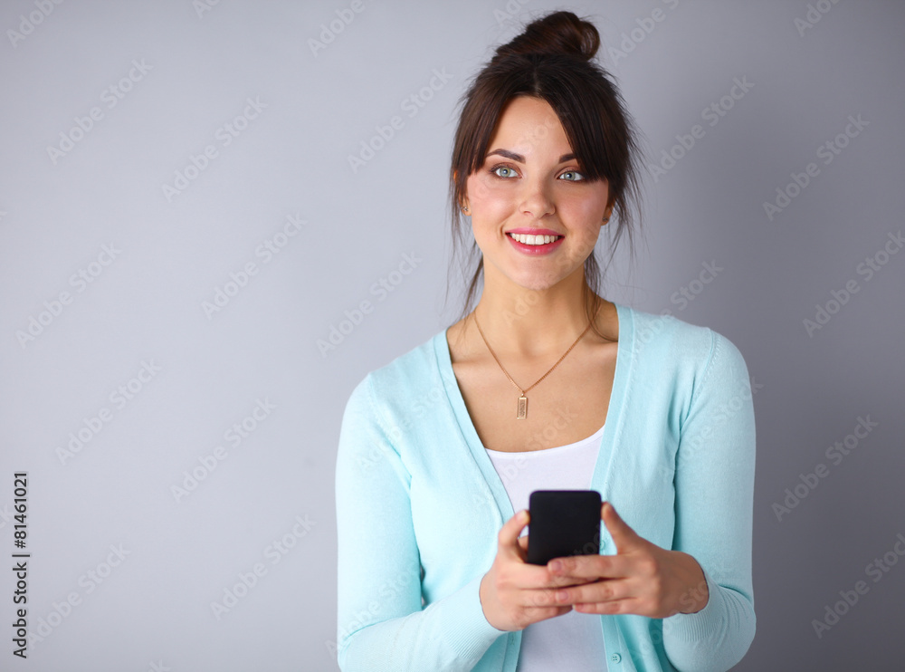 Woman using and reading a smart phone Woman using and reading a smart phone