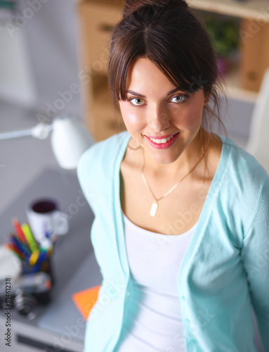 Portrait of businesswoman sitting at desk