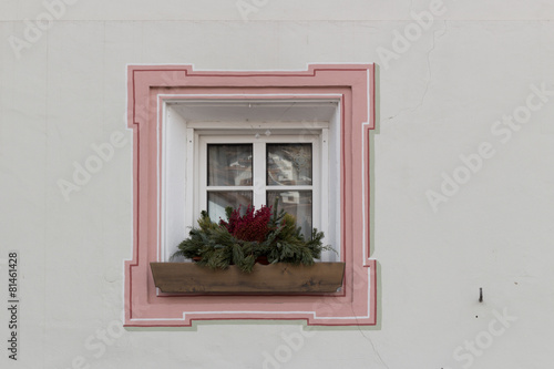 Squared glass window with pink frame and simple border with plan
