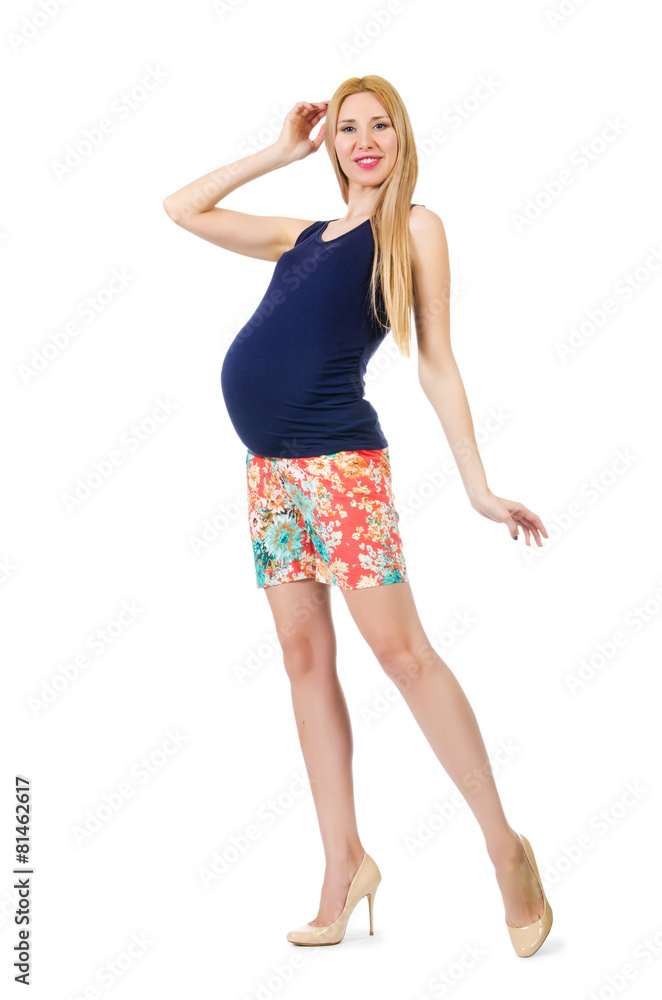 Young pregnant woman in colorful clothing isolated on white Young pregnant woman in colorful clothing isolated on white