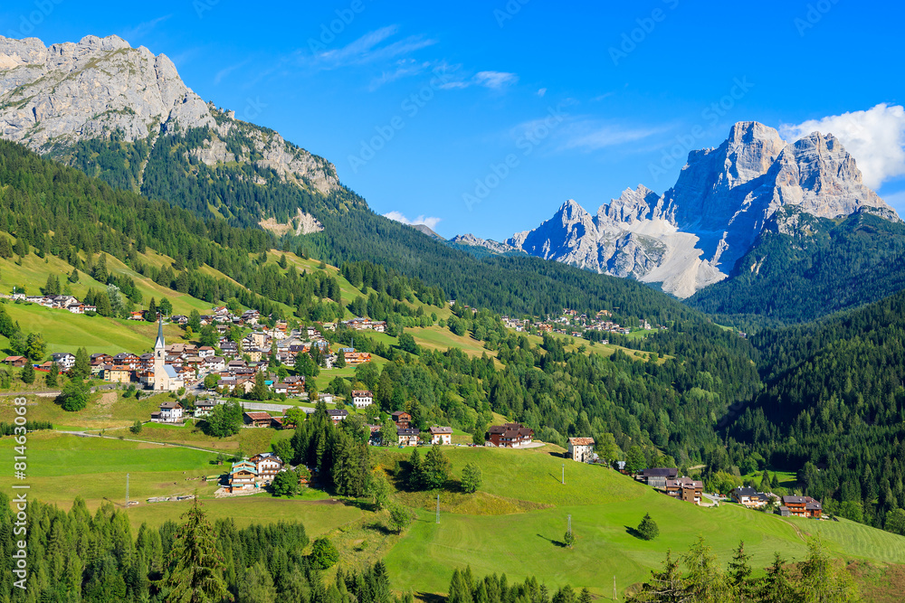 View of green valley and Pian village in Dolomites Mountains View of green valley and Pian village in Dolomites Mountains