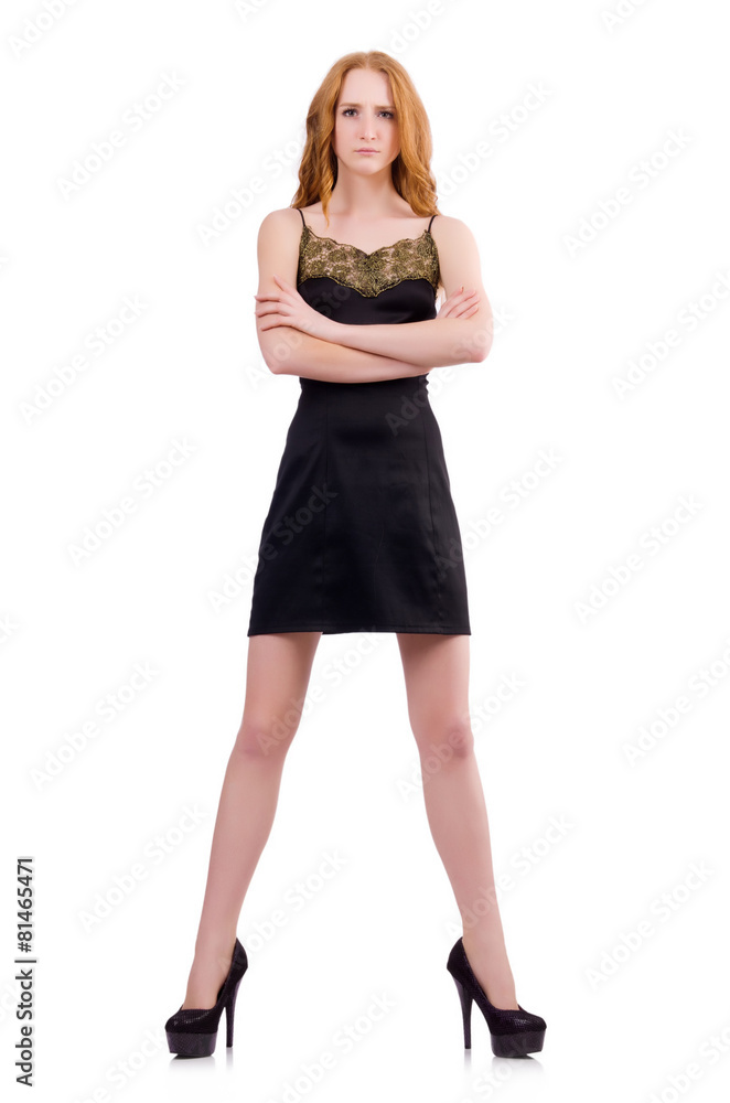A girl in elegant black mini dress isolated on white
