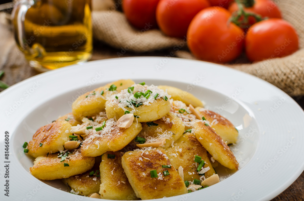 Homemade potato gnocchi with nuts and parmesan Homemade potato gnocchi with nuts and parmesan