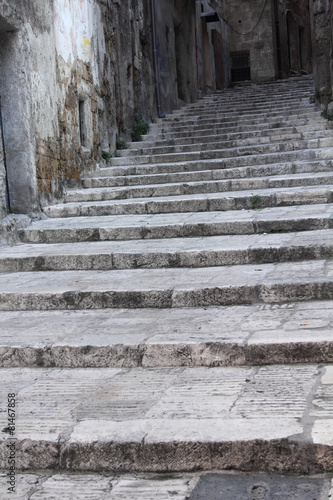 Stone stairway in old Taranto, Italy.