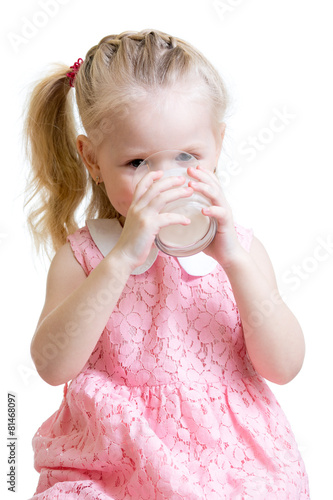 child drinking milk from glass