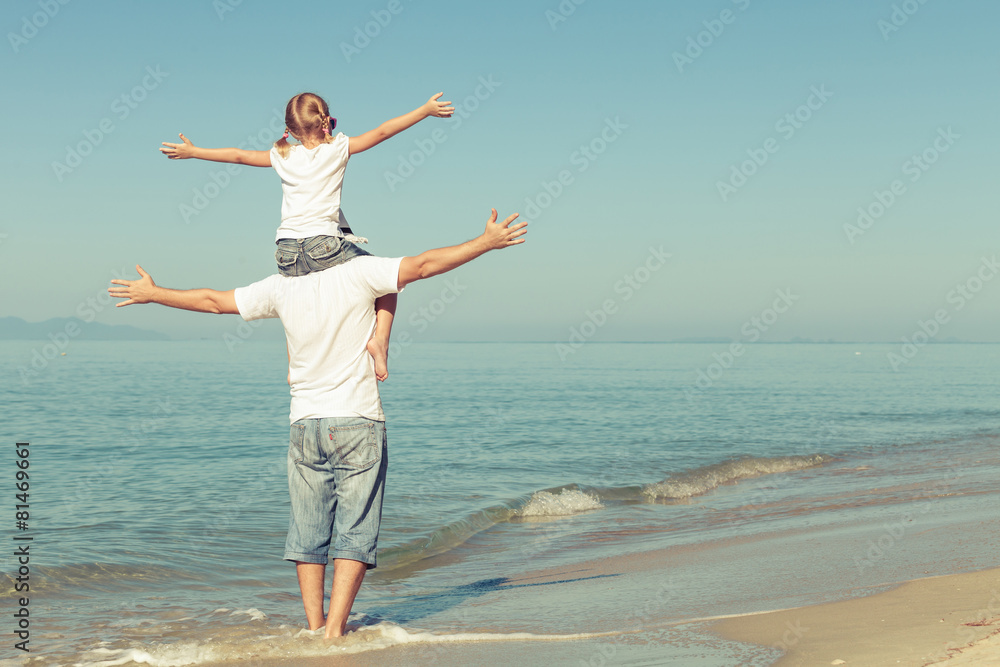 Father and daughter playing on the beach. Father and daughter playing on the beach.