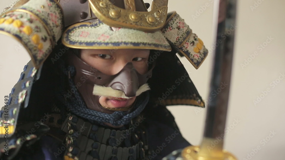 ancient Japanese samurai with katana menacingly posing, close up ancient Japanese samurai with katana menacingly posing, close up