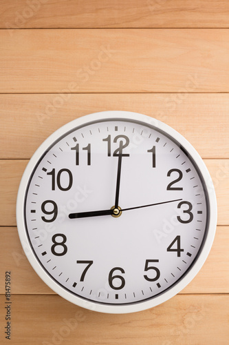 wall clock on wood