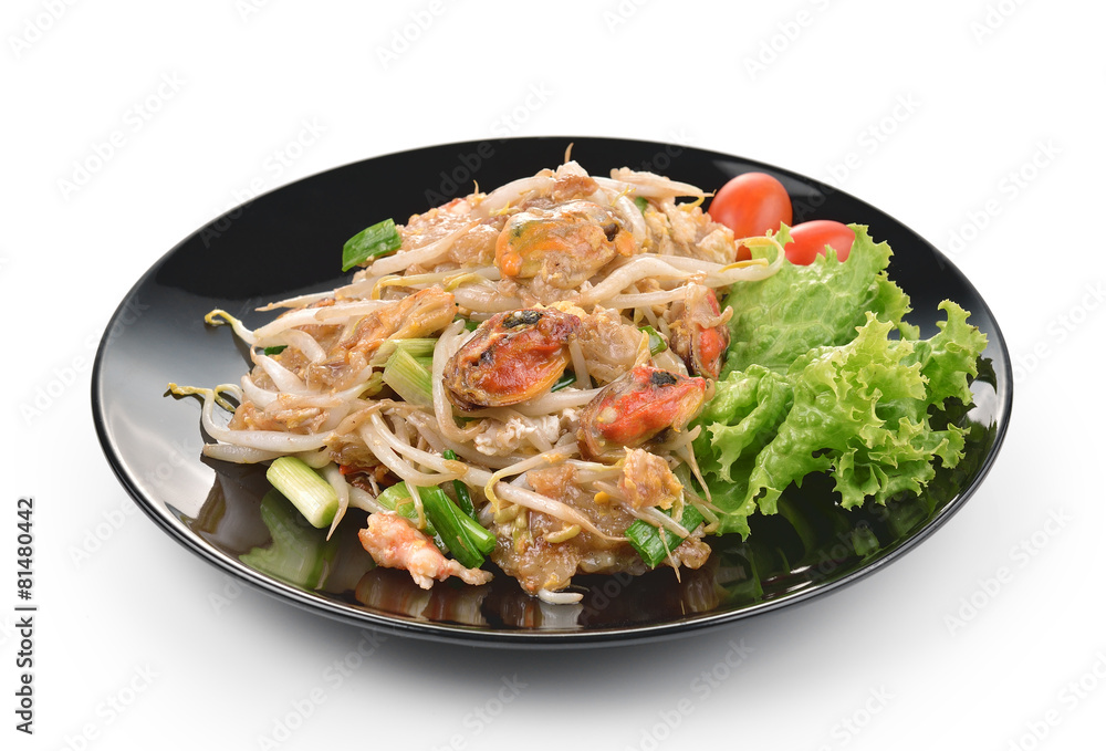 fried mussel with egg on black plate