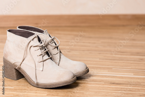 women shoes on wooden floor copy space