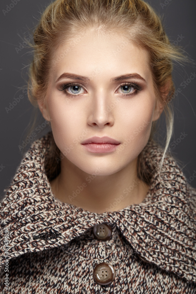 Fototapeta premium Close-up portrait of beautiful girl in knit sweater