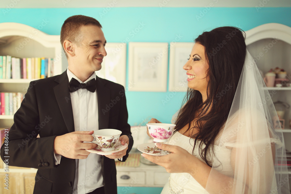 Bride and groom drinking tea Bride and groom drinking tea